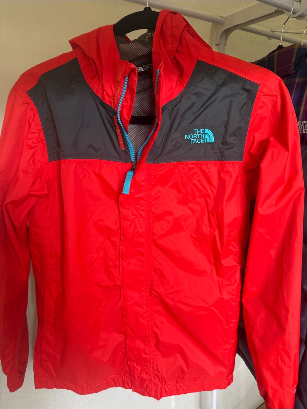 The North Face Red and Dark Gray Hooded Rain Jacket
